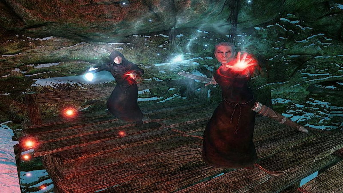 Two vampires in black robes casting spells toward player