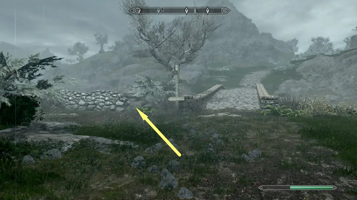 Markarth bridge, wooden sign post, and low stone wall beside it 