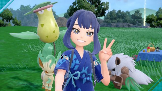 Player and pokemon posing for a photo, holding up a peace sign