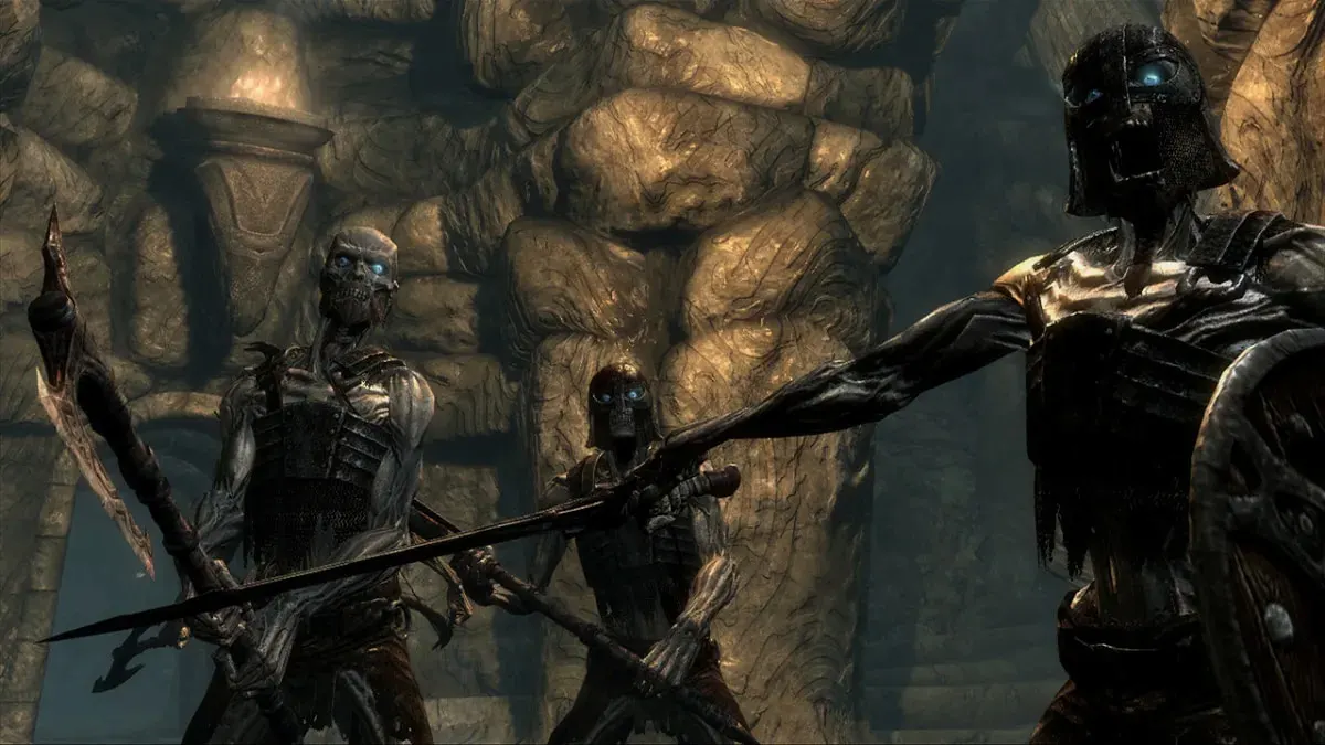three undead skeletons rise to attack the player in skyrim