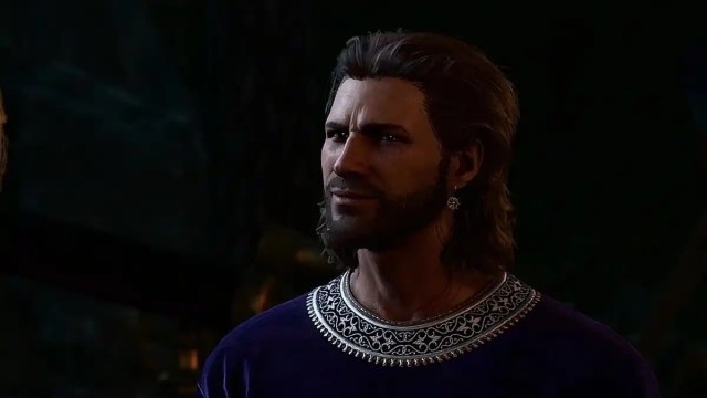 Gale in a blue tunic looking pensive. 