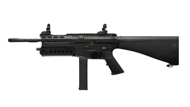 Black short-barrel AMR 9 SMG from side view with long magazine.