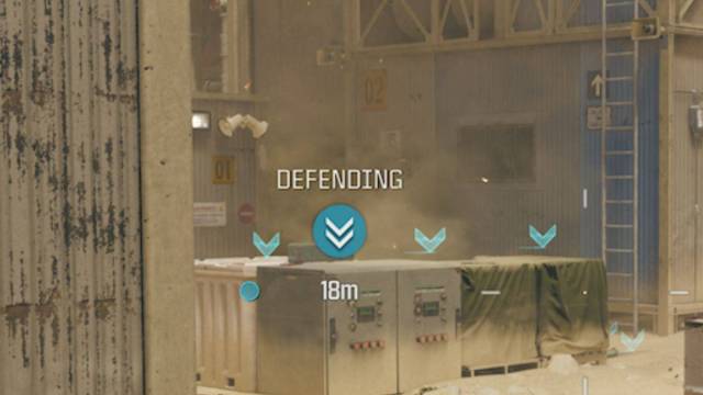 Blue Defending icon with downward chevrons in CoD: MW3 multiplayer.