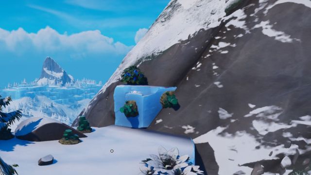 Snow capped mountain in the Frostlands of LEGO Fortnite with Malachite ore sticking out.