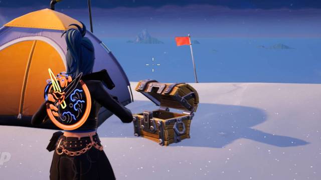 Fortnite Chapter 5 Season 1 screenshot with opened treasure chest and orange tent on snow.