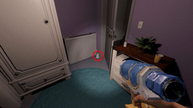 A snowman hiding behind a door.