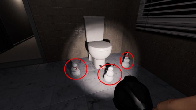 Three snowmen worshiping a toilet at 10 Ridgeview Court.