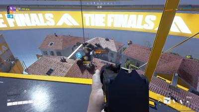 A player in The Finals shooting at an enemy in another building.