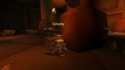 Grizzby standing inside Ratchet Inn