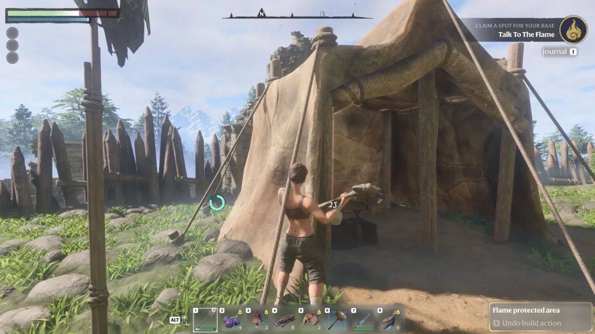 The player destroying a tent in Enshrouded