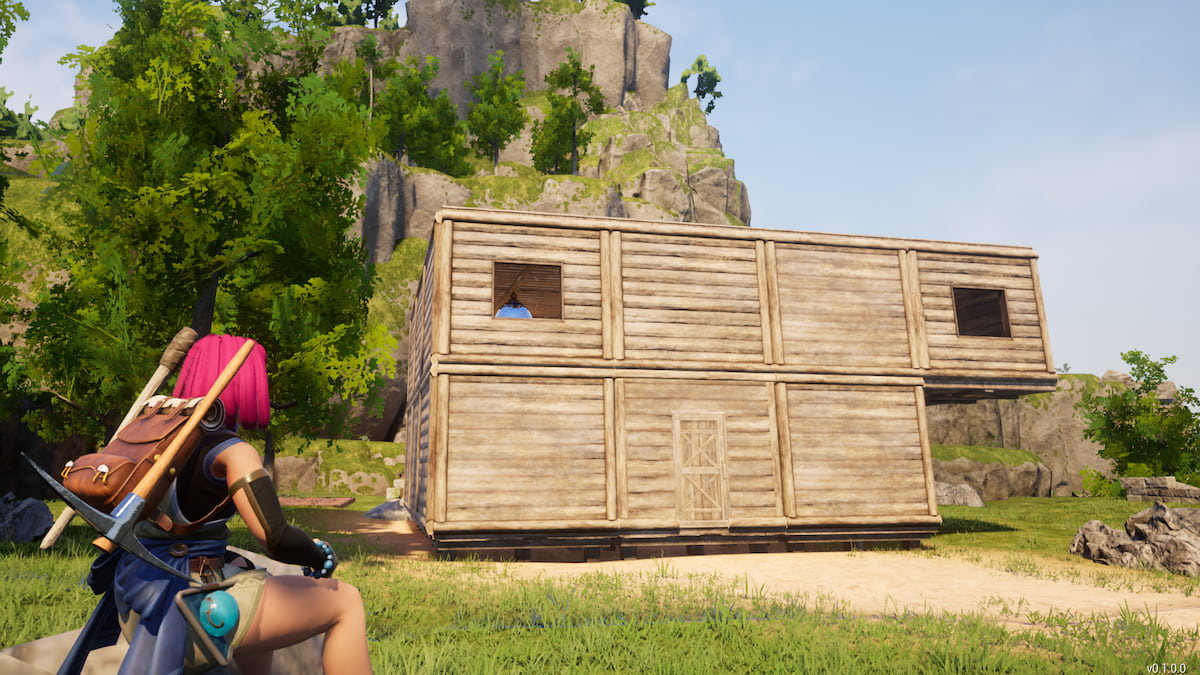 A player character sitting in front of a house.
