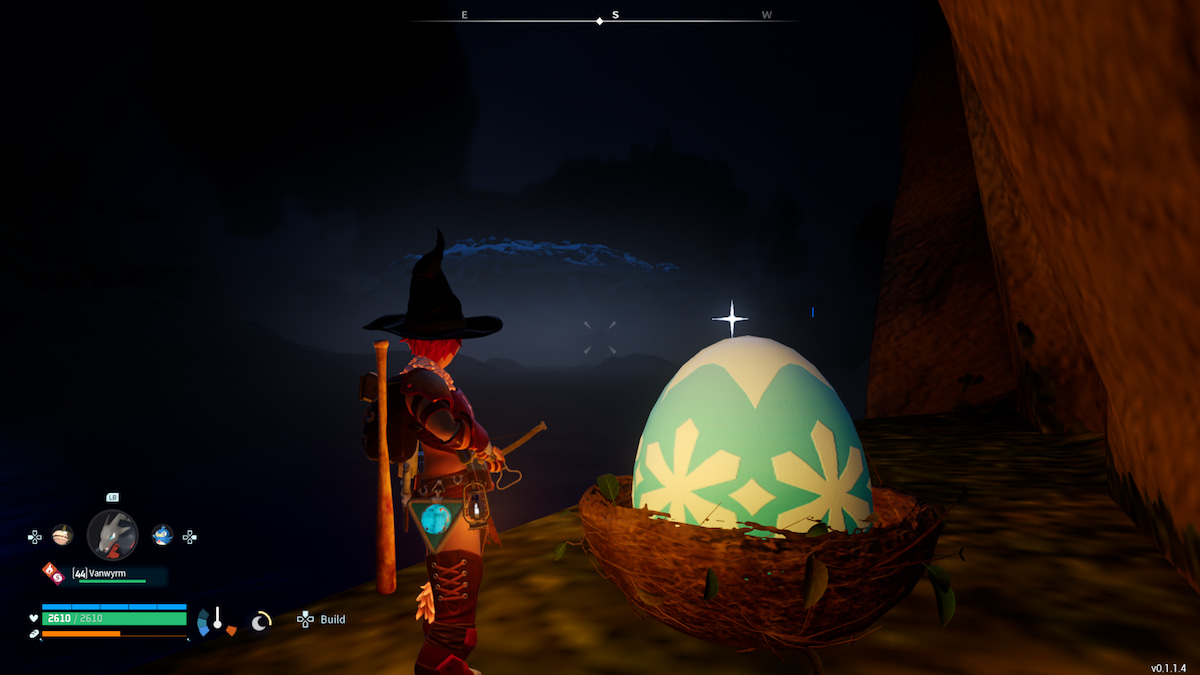 A player standing next to a blue and white Huge Frozen Egg at night.