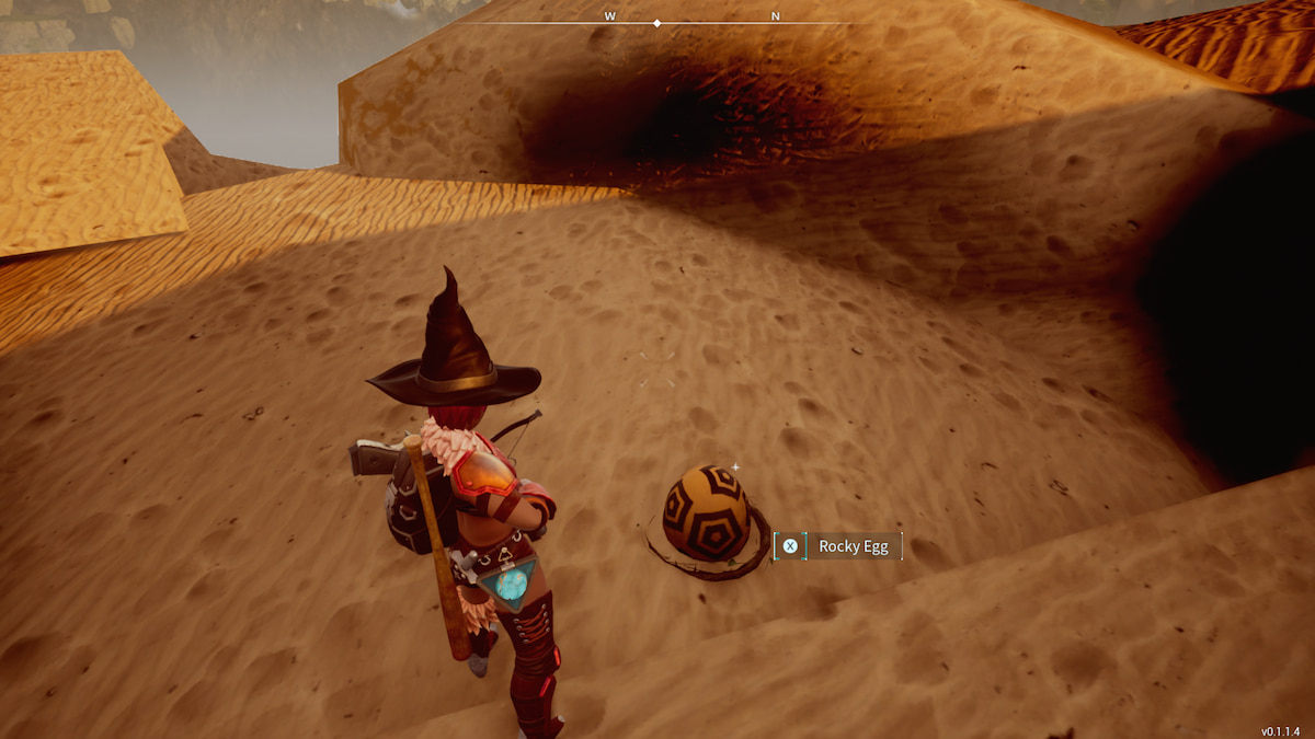 Palworld player looking down at a Rocky Egg in the Desert.