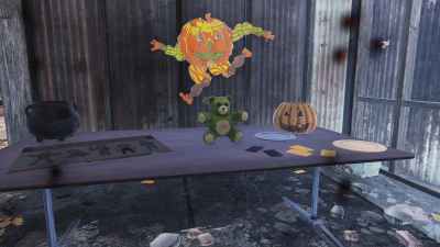 Radbear on a table with Halloween decorations.