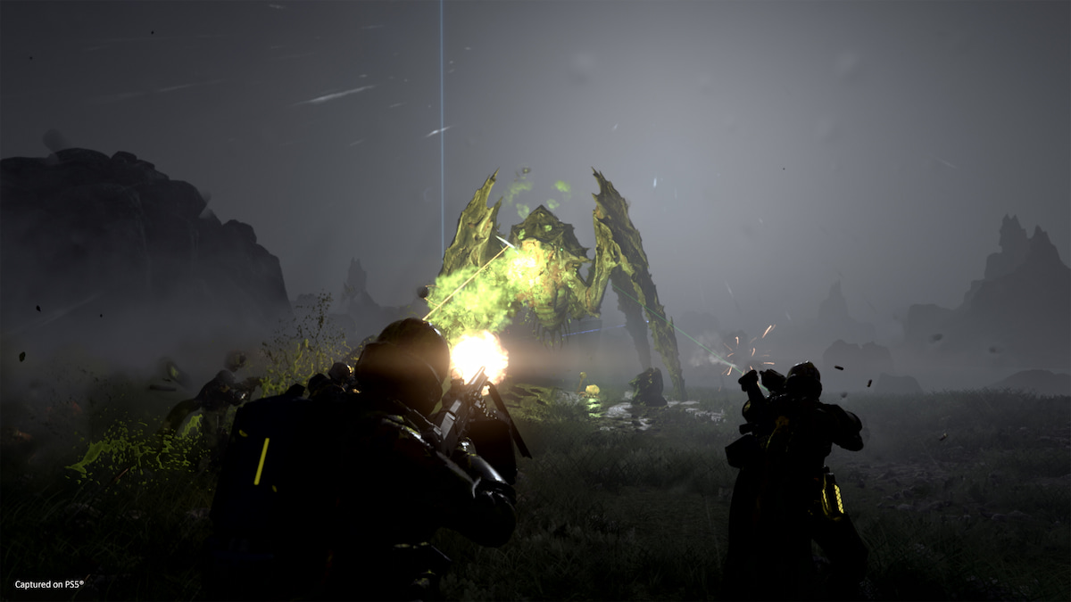 Players aiming at an alien bug enemy