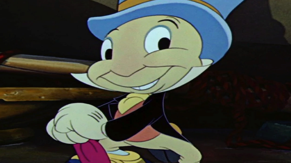 Jiminy Cricket with red umbrella and blue hat, smiling