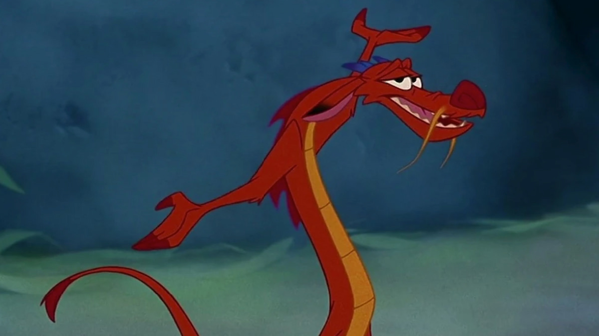 Mushu the dragon from Mulan with arms outstretched and smiling