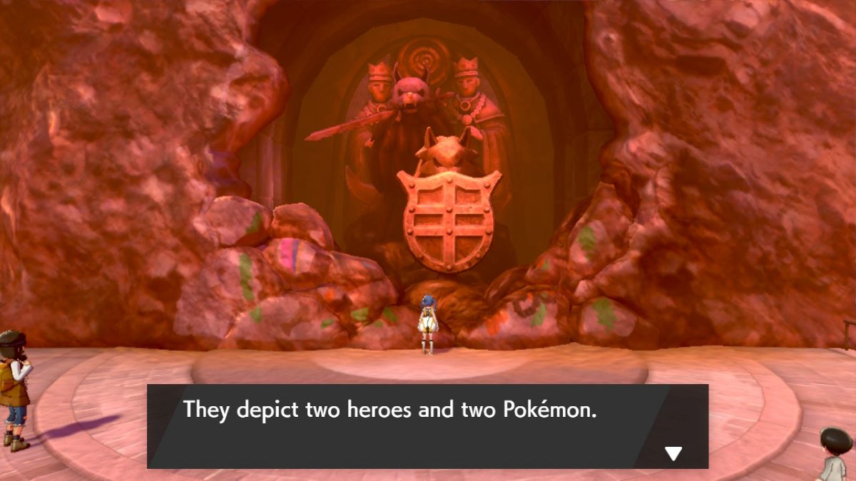 Player inspects statues depicting two heroes and two Pokemon in Pokemon Sword & Shield