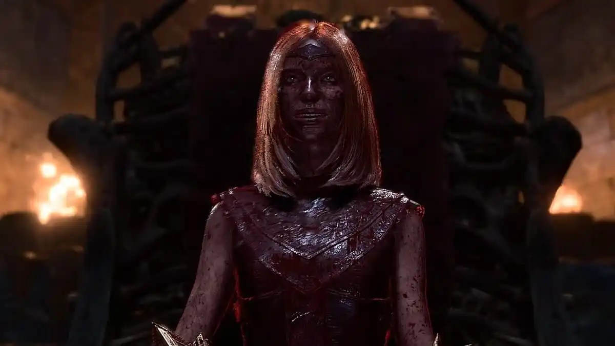 a mage woman covered in blood smiling