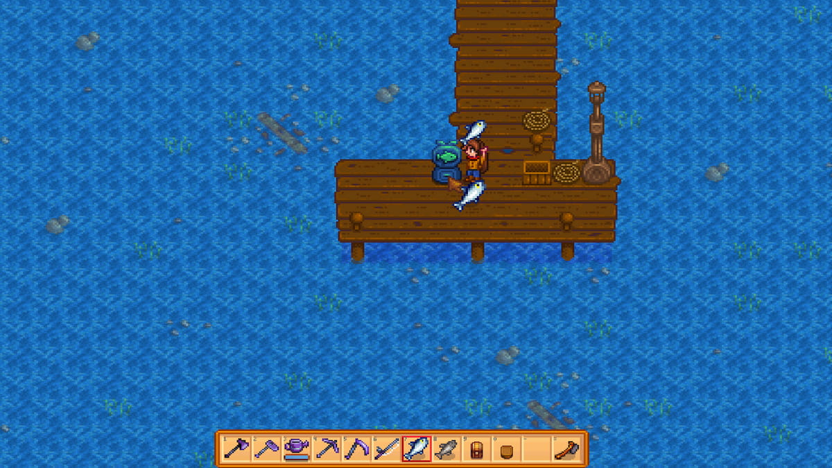 Player holding fish and placing it into Bait Maker machine