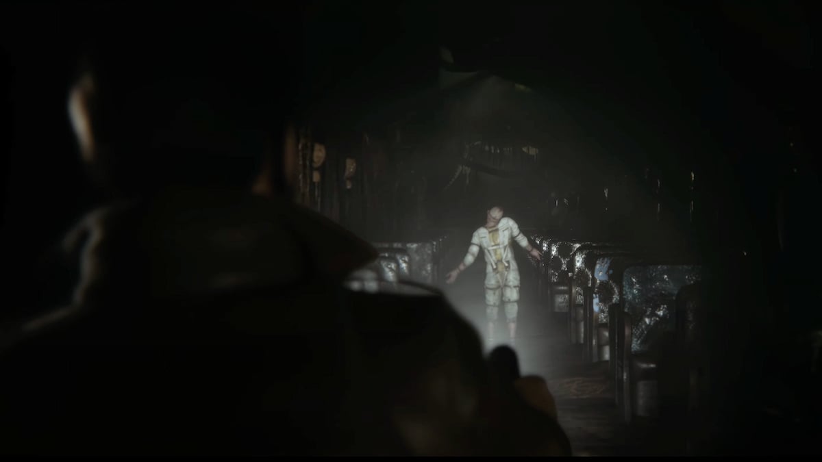 A demonic creature is stood down a dark corridor illuminated by torchlight from the main character in The Sinking City 2
