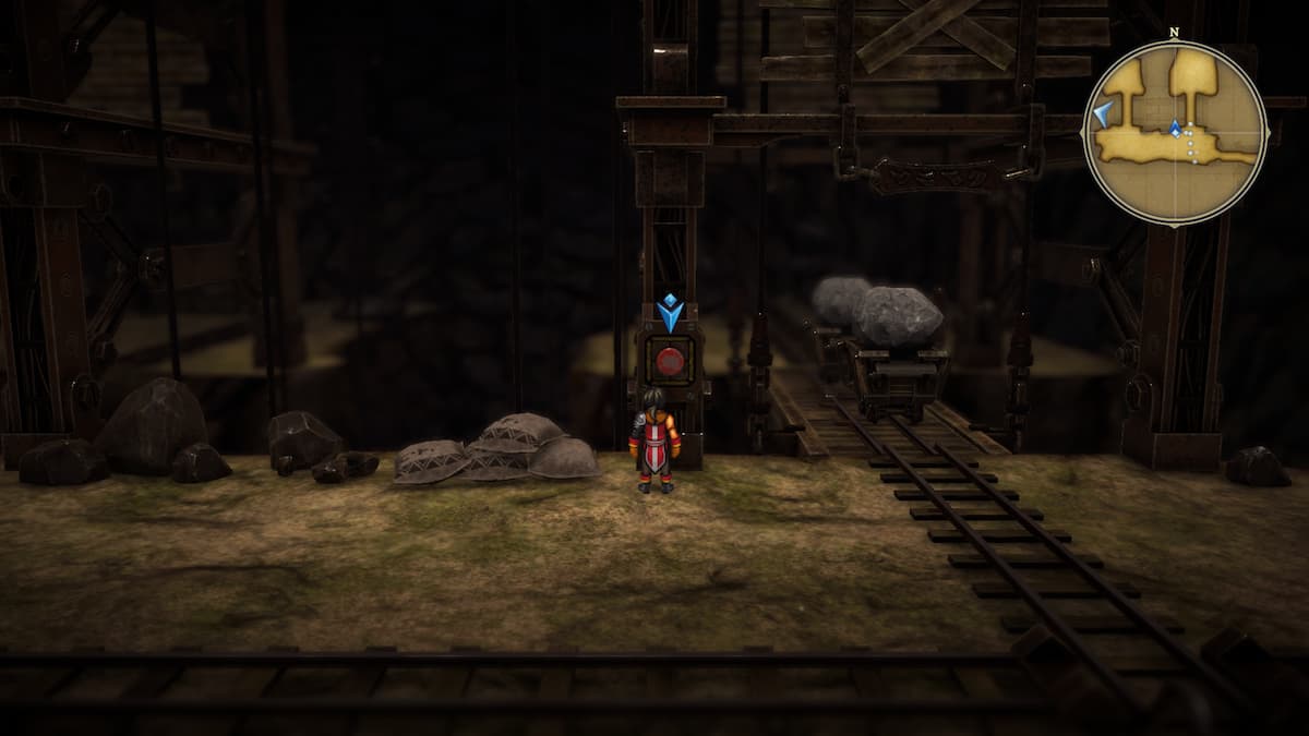 Two mine carts on the elevator track side by side and Nowa standing by the red button beside it