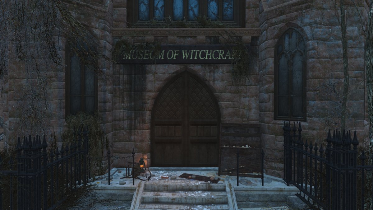 A closeup of the entrance of the Museum of Witchcraft, the name of the building is written above the door.