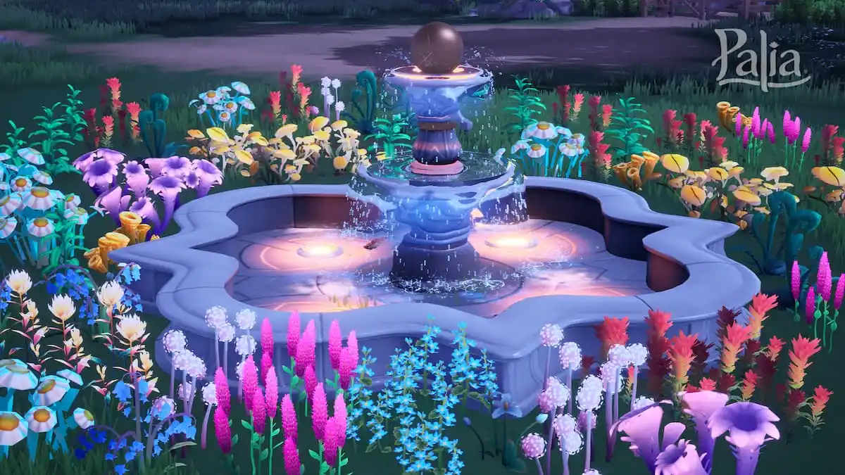 Fountain surrounded by flowers.