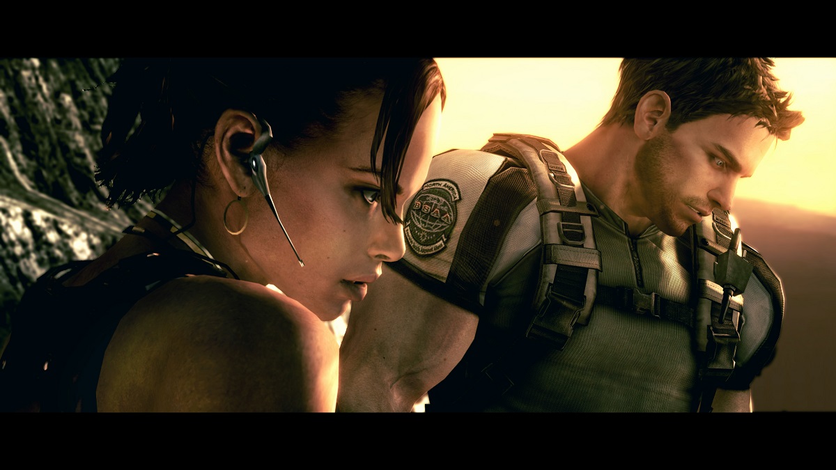 Sheva and Chris stand together and look down