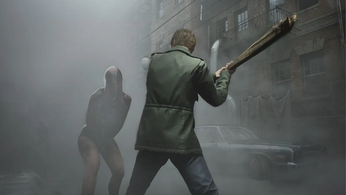 James hitting a silent hill creature with a bat