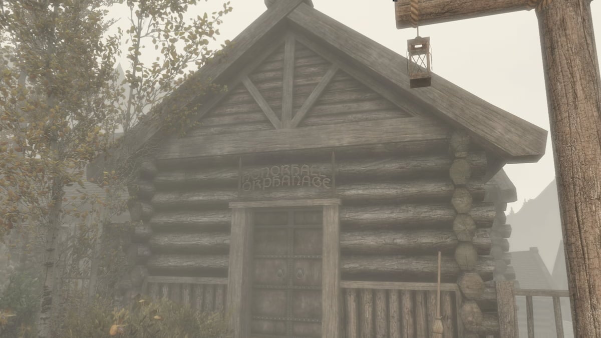 Honorhall Orphanage in Riften, wooden lodge building with sign above the door