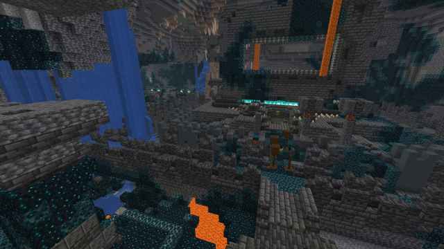 An Ancient City in a Dripstone Cave with a pool of lava and a large waterfall in Minecraft