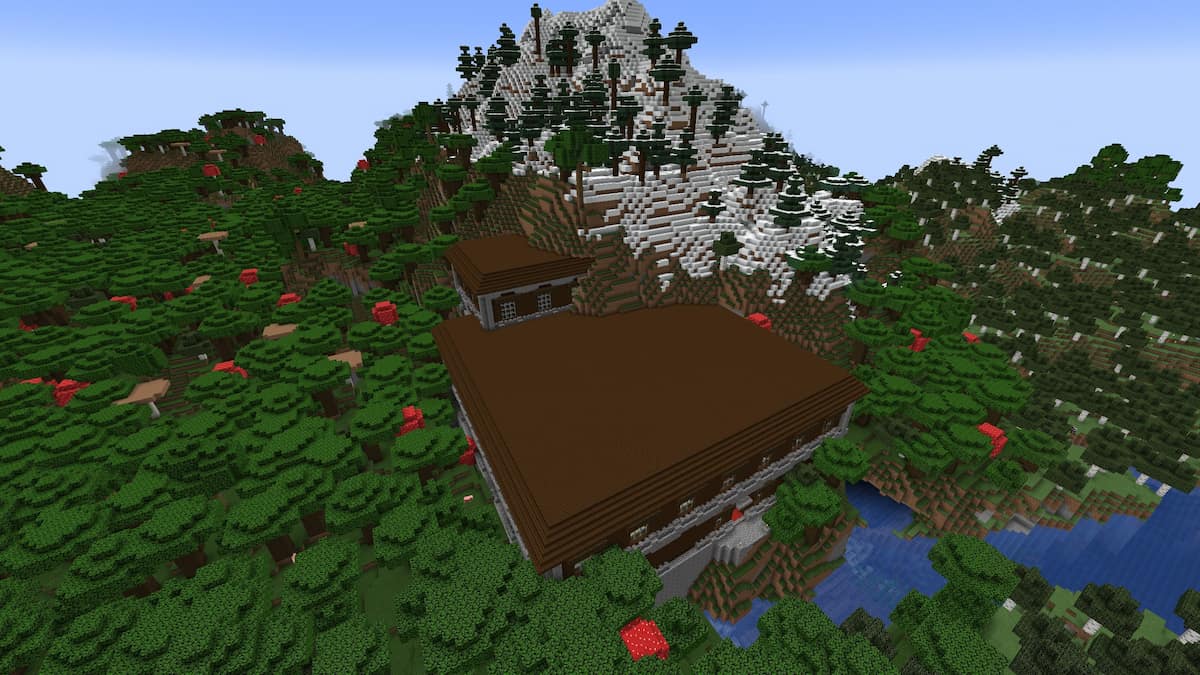 A Minecraft Woodland Mansion partially inside of a Snowy Peaks mountain