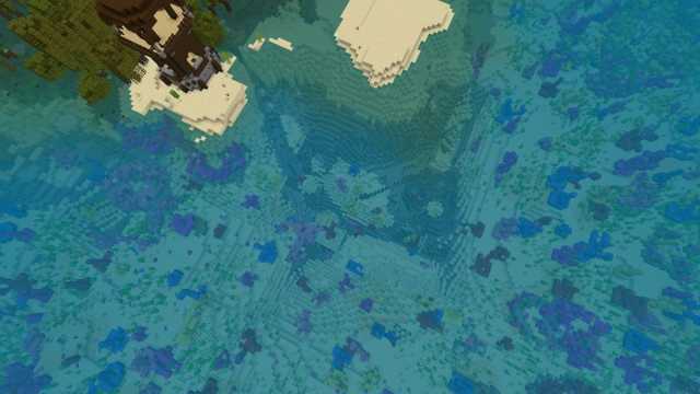 A Minecraft Pillager Outpost next to an underwater ravine filled with coral