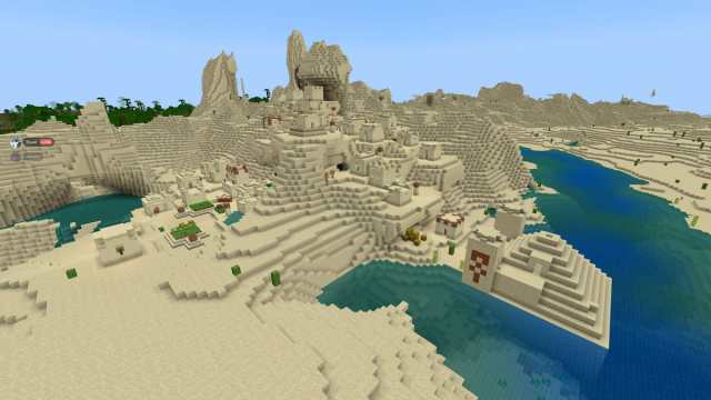 A Desert Temple inside a river next to a Desert Village in Minecraft