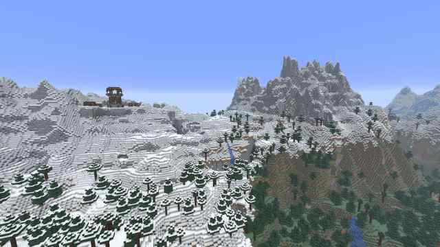 A set of Minecraft mountains with a Pillager Outpost