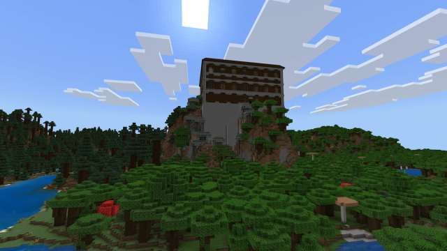 A tall Woodland Mansion next to a Pale Garden in Minecraft