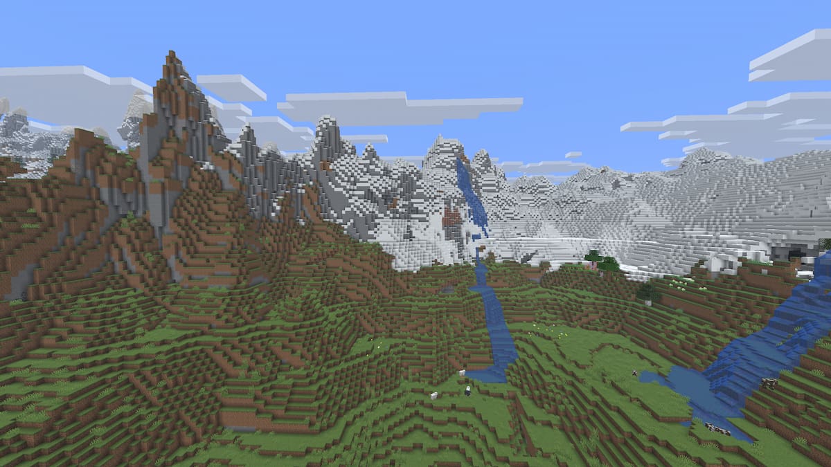 A set of Jagged Peaks mountains with a Snowy Slopes biome in Minecraft