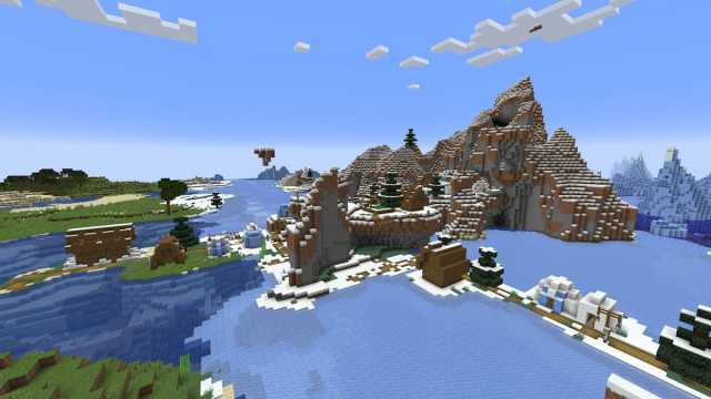 A Minecraft island with a Snowy Village that is half in a Frozen Ocean and half in a Cold Ocean