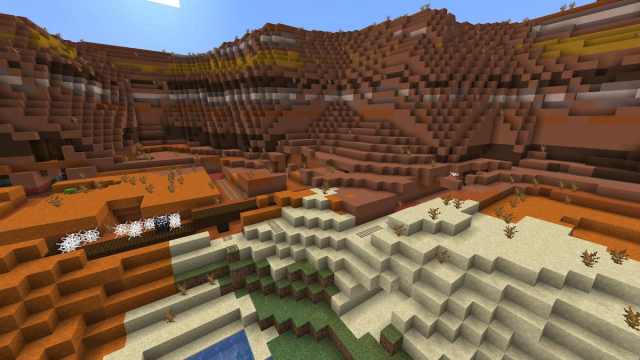 An exposed mineshaft in a Minecraft Badlands biome