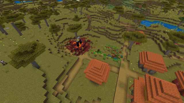 A ruined Nether portal missing two obsidian blocks next to a Savanna Village in Minecraft
