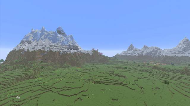 A set of Minecraft mountains surrounding a Plains biome with a village