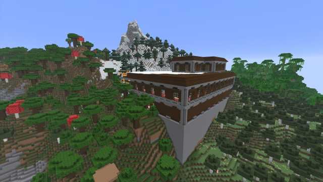 A Minecraft Woodland Mansion catching fire while on the side of a snowy mountain