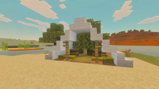 An Abandoned Camp structure in a Minecraft Desert with a Wooded Badlands biome in the background