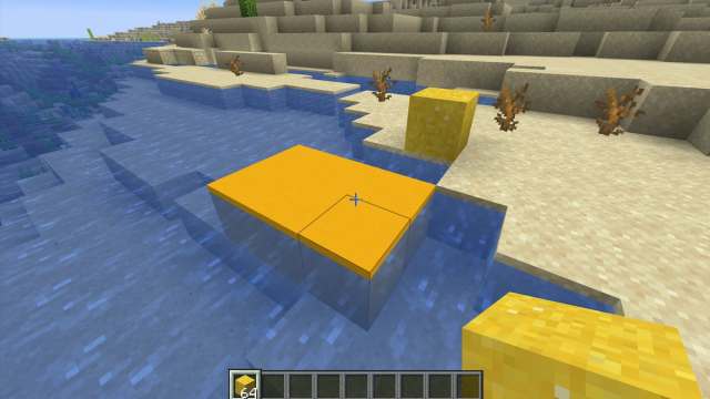 Turning yellow concrete powder into yellow concrete in Minecraft