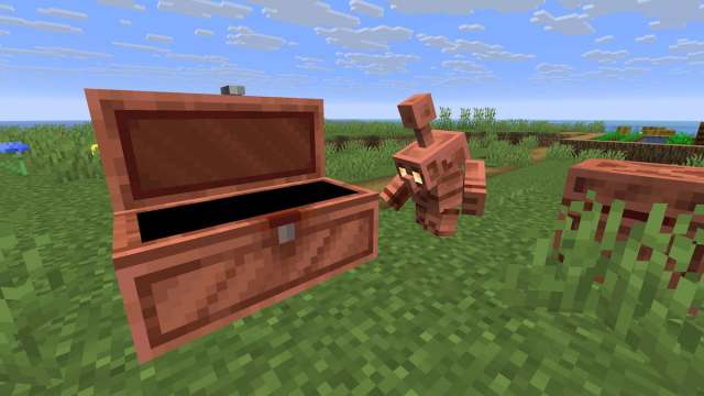 A Copper Golem opening a Copper Chest in Minecraft