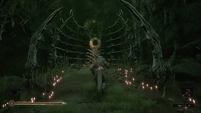 Solomon walking up to the Strange Altar made of bone, surrounded by lit candles.