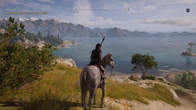 Cassandra sits on a white horse overlooking a bay in Greece