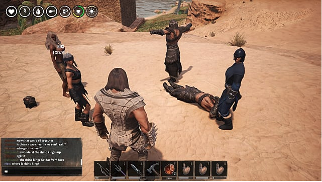 A group of warriors stands in a circle in the desert