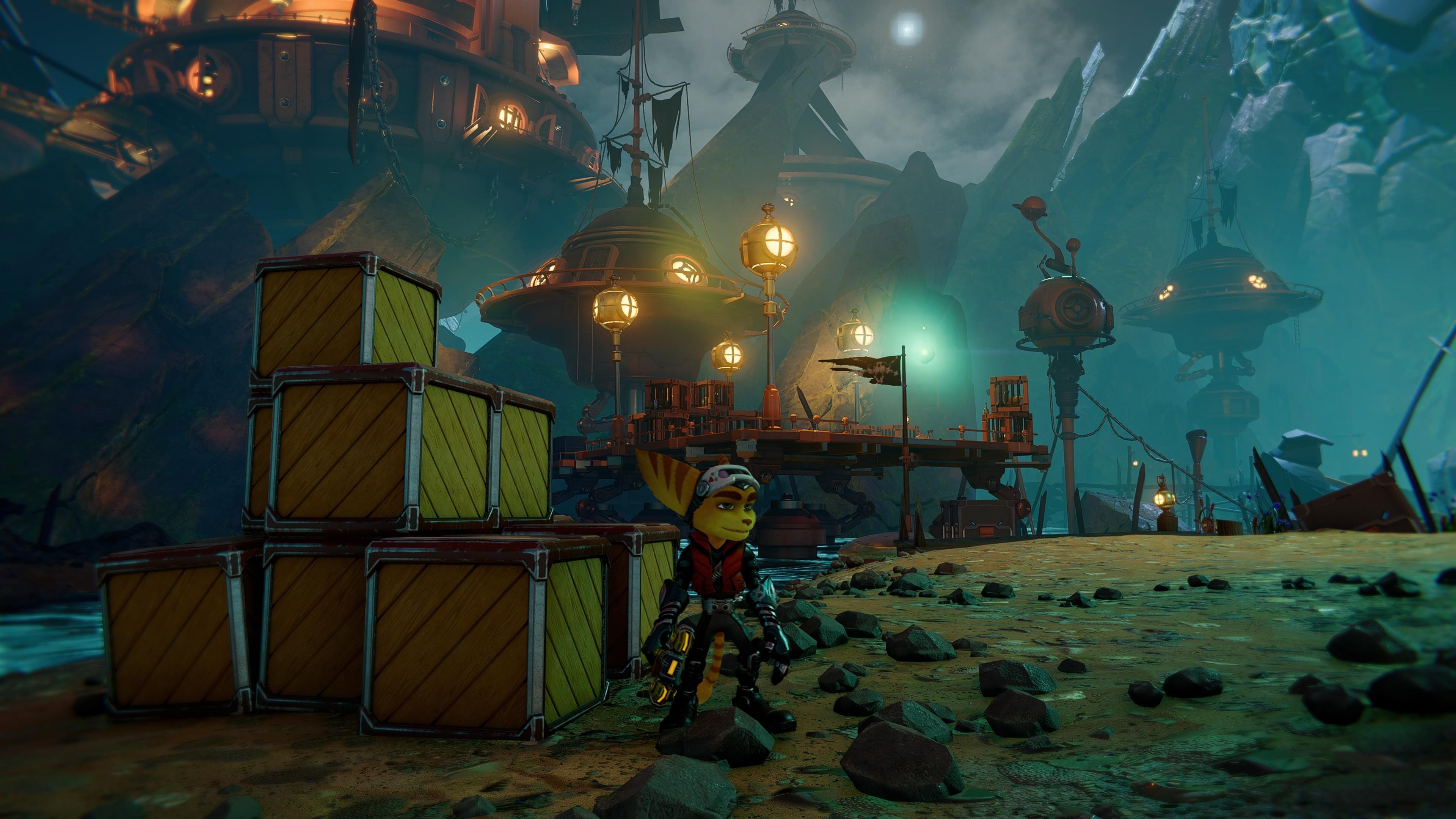 Ratchet wearing a visor and standing in front of a stack of crates on a dark beach.